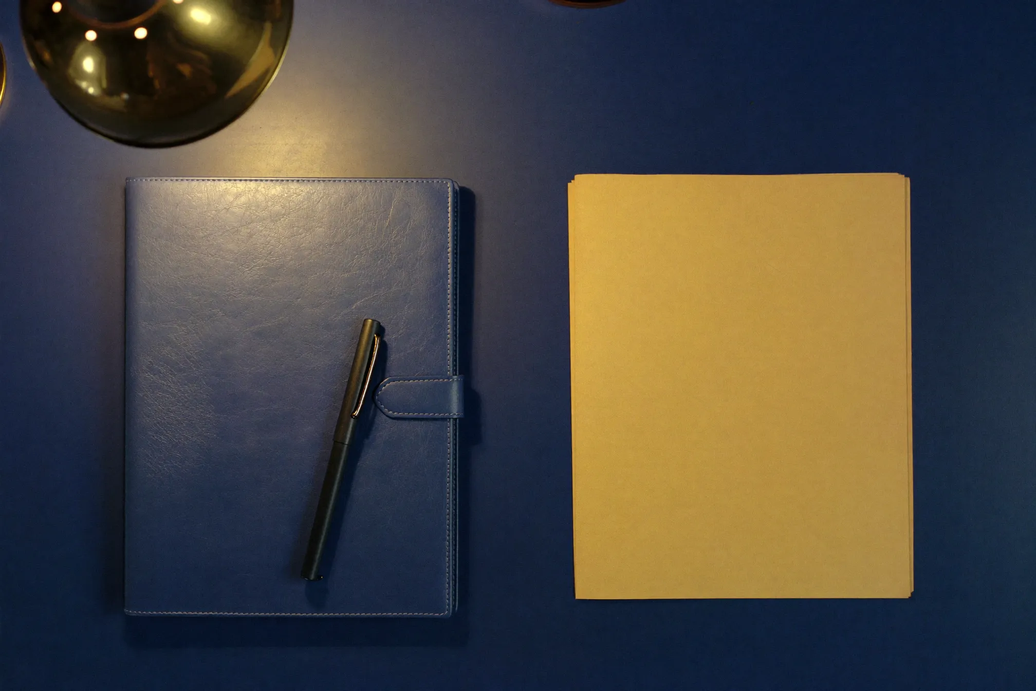 An advisor’s desk under lamp light