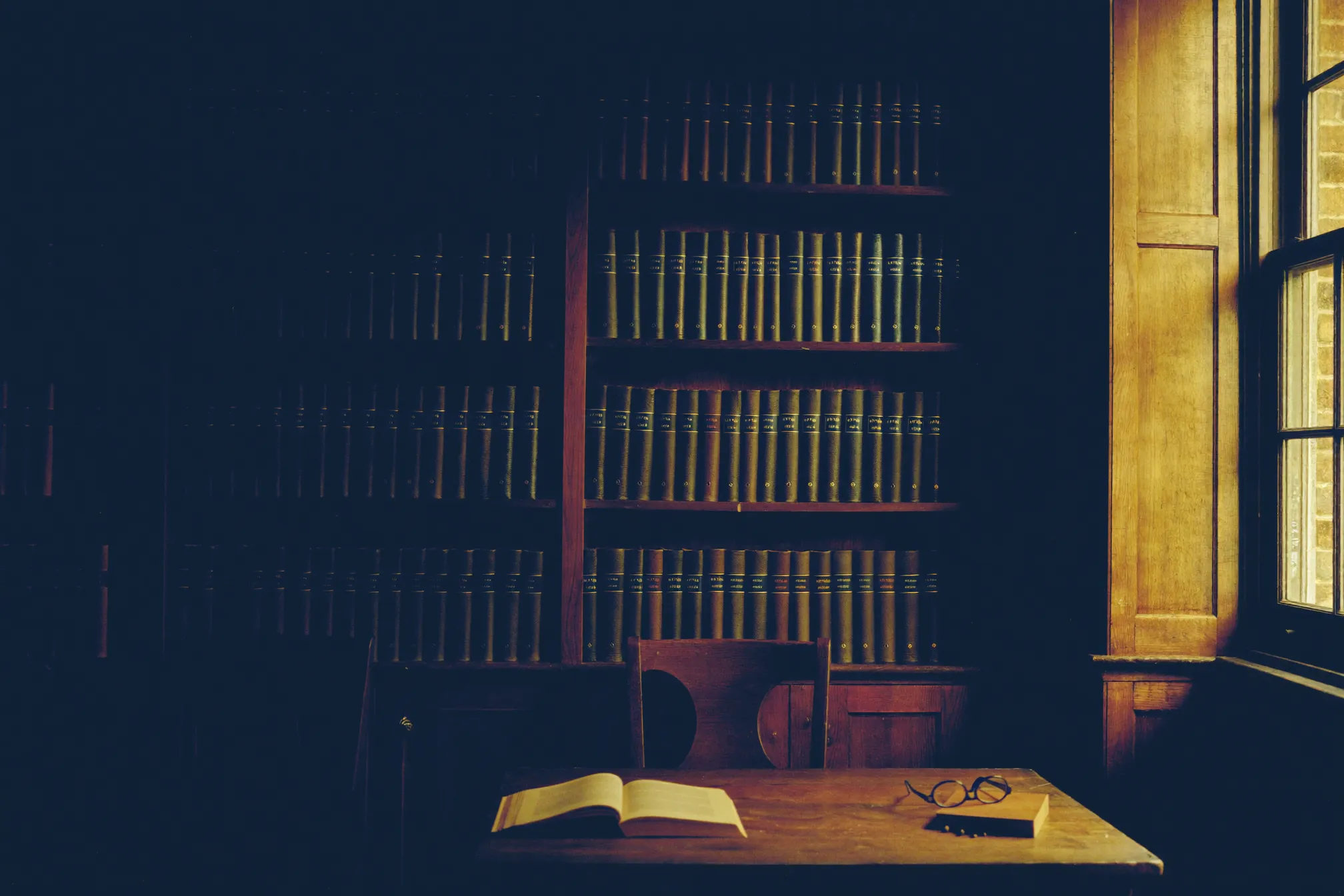 A law library reading table in morning light